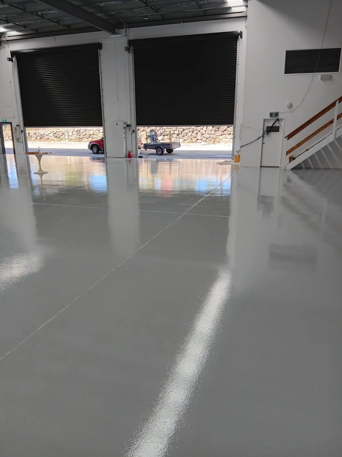 Smooth grey finished floor in a large commercial space
