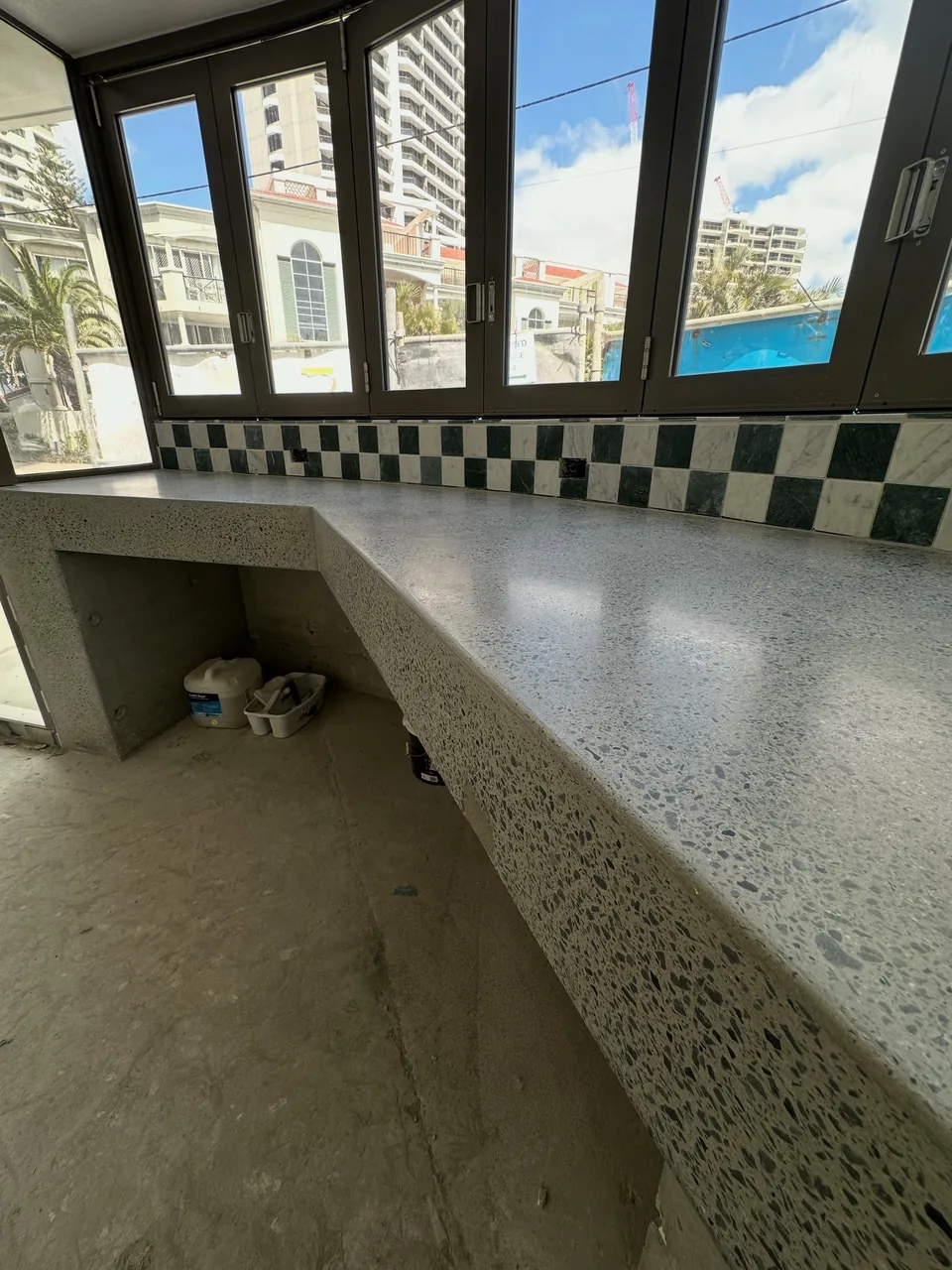 Restored concrete benchtop showing exposed aggregate and a sealed finish