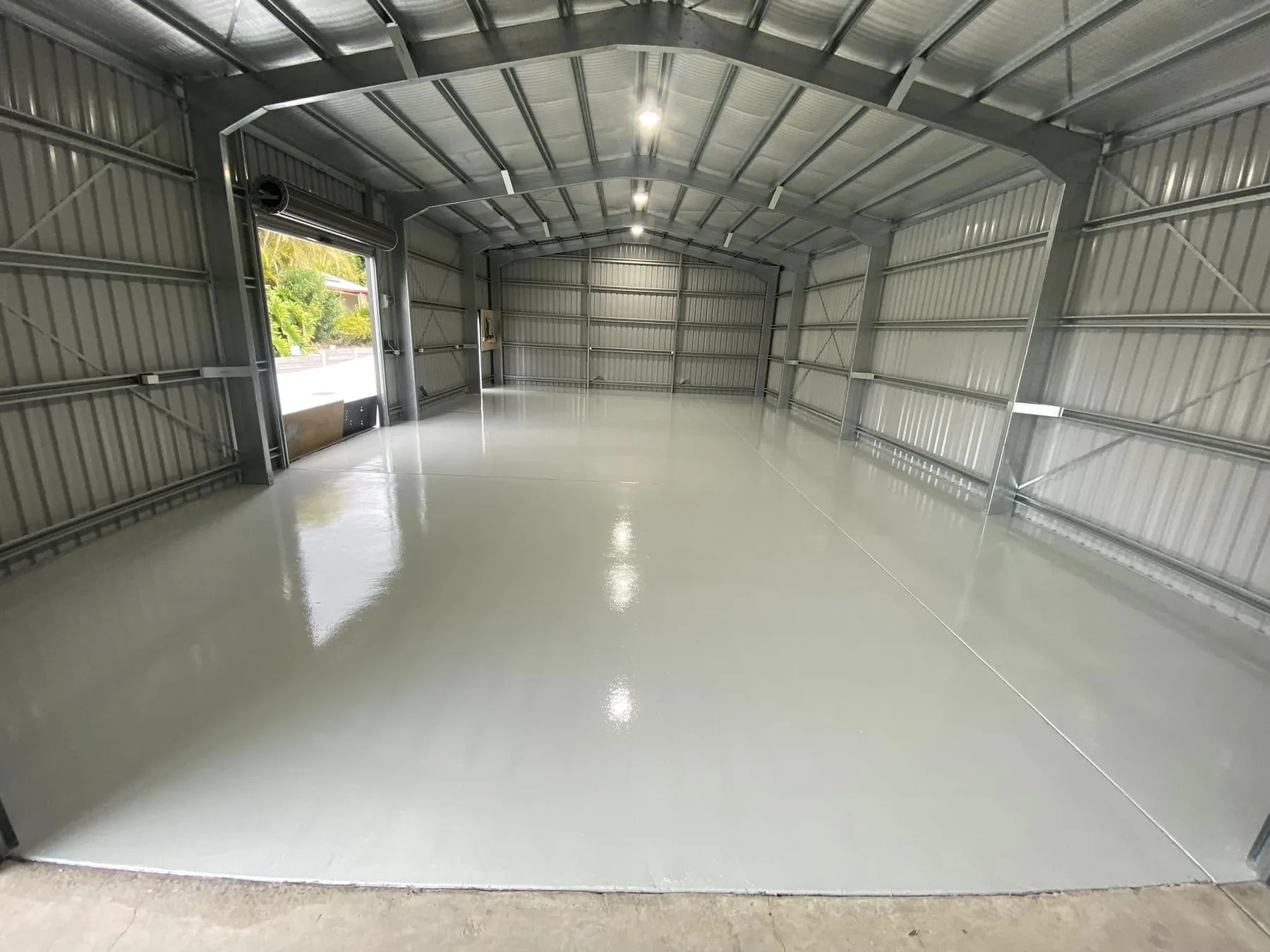 Completed seamless grey workshop floor by Frenchys Flooring
