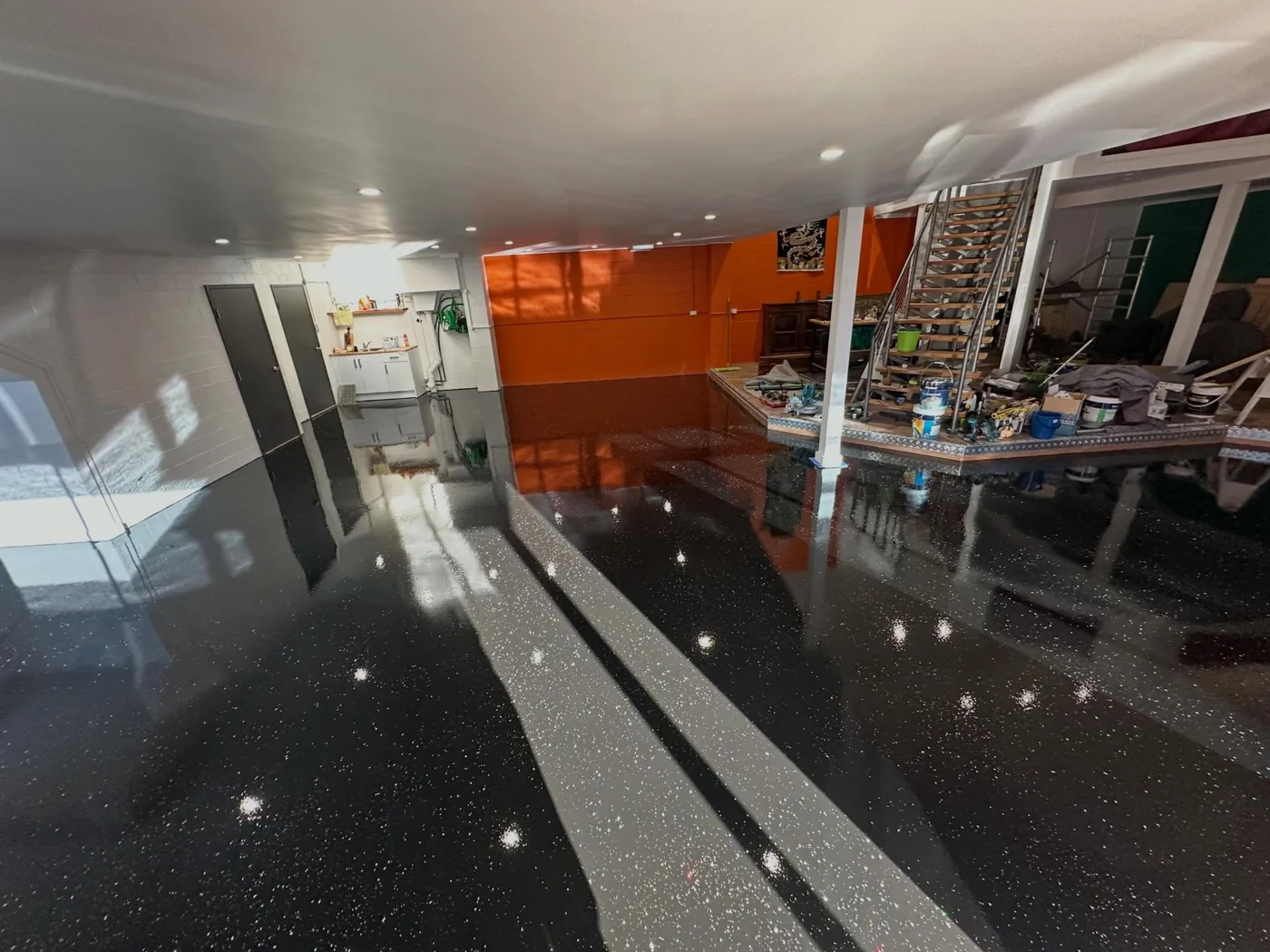High-gloss dark finished concrete floor in a commercial interior