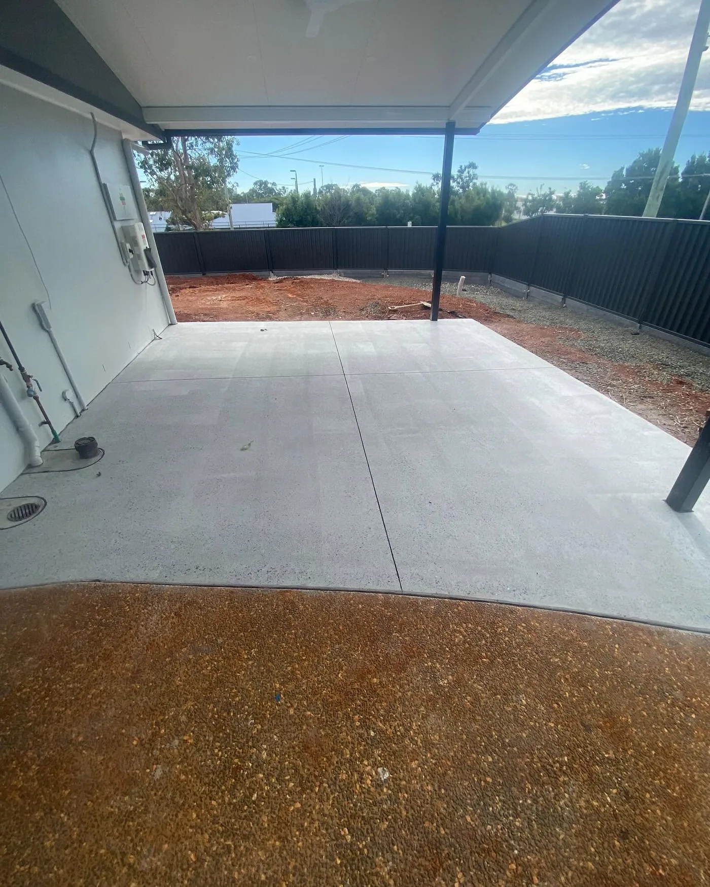 Prepared concrete patio surface at a residential property
