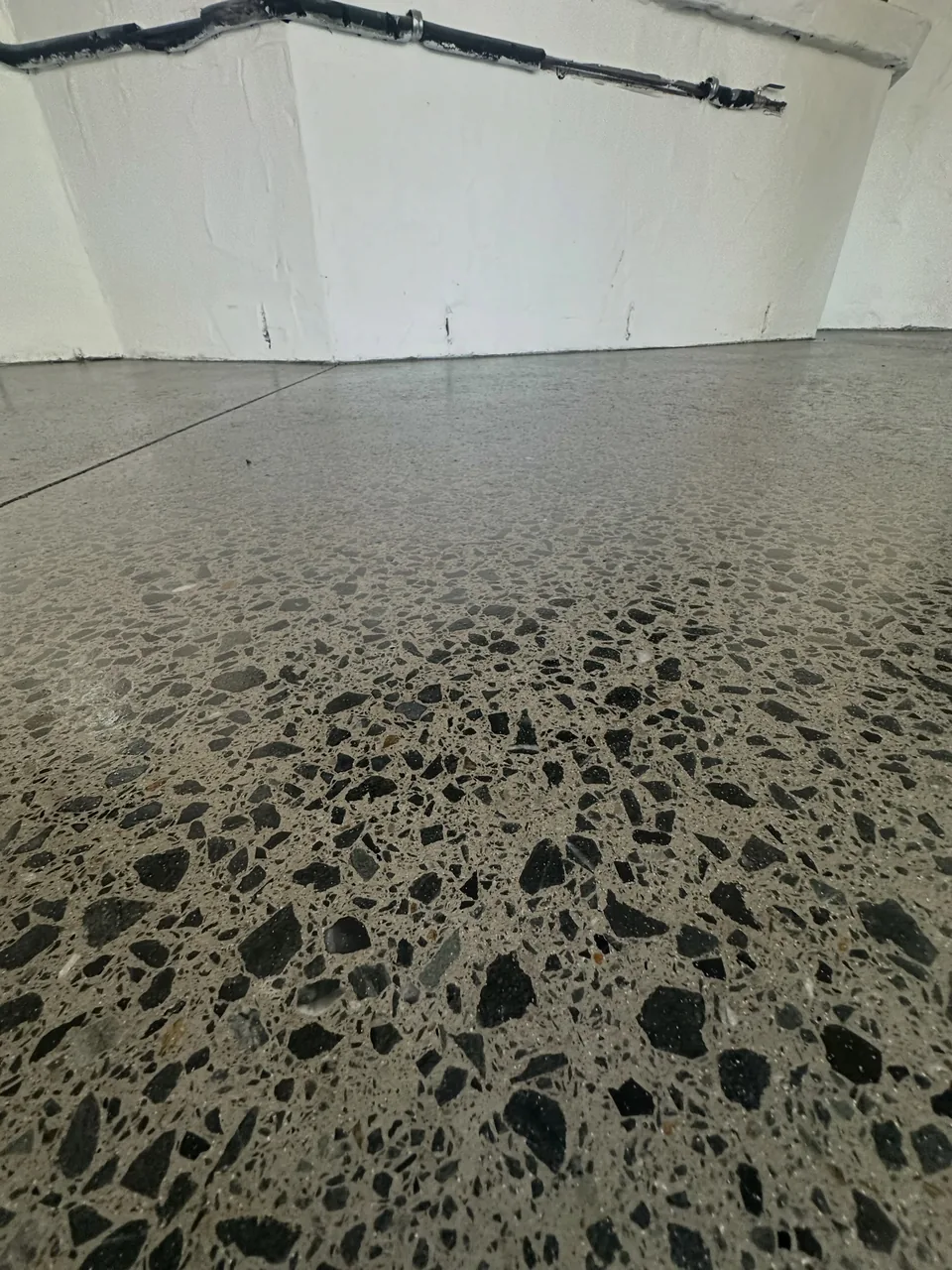 Detail of aggregate exposed through concrete honing